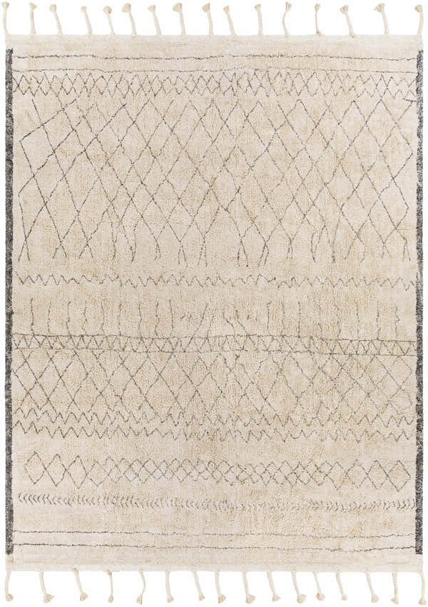 Close-up of the Jacana Area Rug. Cream cotton rug with gray geometric diamond pattern and tassels. Hand woven. Design-Rectangle-810