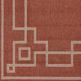 Close-up of the Brick Red Jarrell Area Rug, featuring a geometric light beige border design. Swatch
