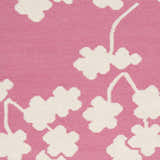 Close-up of the Johnstown Area Carpet. Light beige floral design on a rose pink, hand-woven wool rug. Swatch