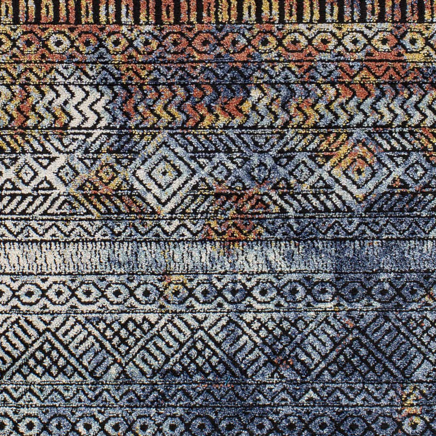 Close-up of the Joroan Area Carpet, a bohemian style rug with blue, orange, and black geometric patterns. Swatch