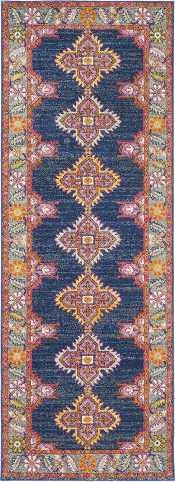 Detailed view of the Kaitlyn Navy Area Rug, a runner with a bohemian-inspired floral and geometric pattern in navy, orange, and pink. Design-Runner-2773