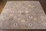 Detailed view of the Kajiado Area Rug, showcasing its charcoal, cream, and pale blue bohemian pattern. Front