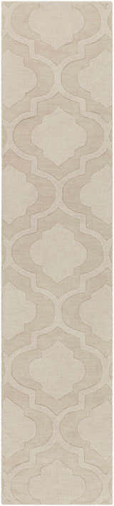 Close-up of the tan Kake Carpet, a hand-loomed wool rug with a contemporary geometric pattern. Neutral tones. Design-Runner-310