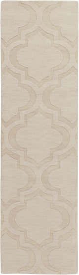 Close up of the tan Kake Carpet, a hand-loomed wool rug with a raised geometric trellis pattern. Design-Runner-38