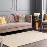 Living room scene with a tan Kake Carpet, gray sofa, and copper accent table. Contemporary style. Roomscene-Rectangle