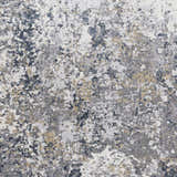 Close-up of the Kanahooka Area Rug. Abstract design in charcoal, dark blue, light beige, light gray, and tan. Swatch