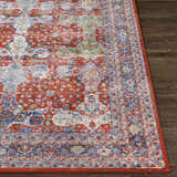 Close-up of the Kangundo Washable Area Rug in blush, cream, red, and blue with a traditional oriental pattern. Front