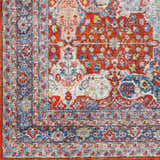 Close-up of the Kangundo Washable Area Rug, showcasing its red, blue, and cream traditional floral pattern and soft texture. Swatch