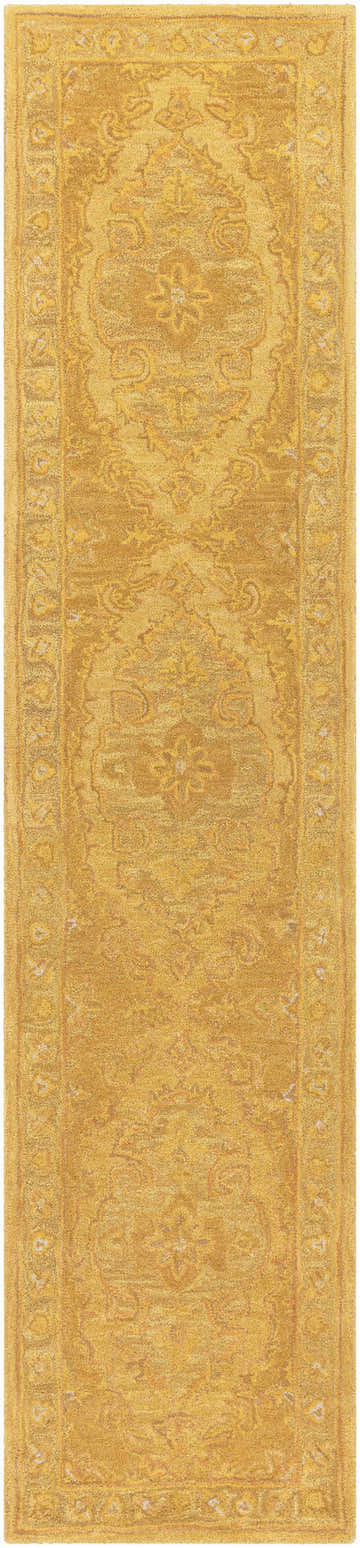 Close-up of the hand-tufted Kapowsin Wool Area Rug in mustard yellow with a traditional, vintage-inspired oriental pattern. Design-Runner-310