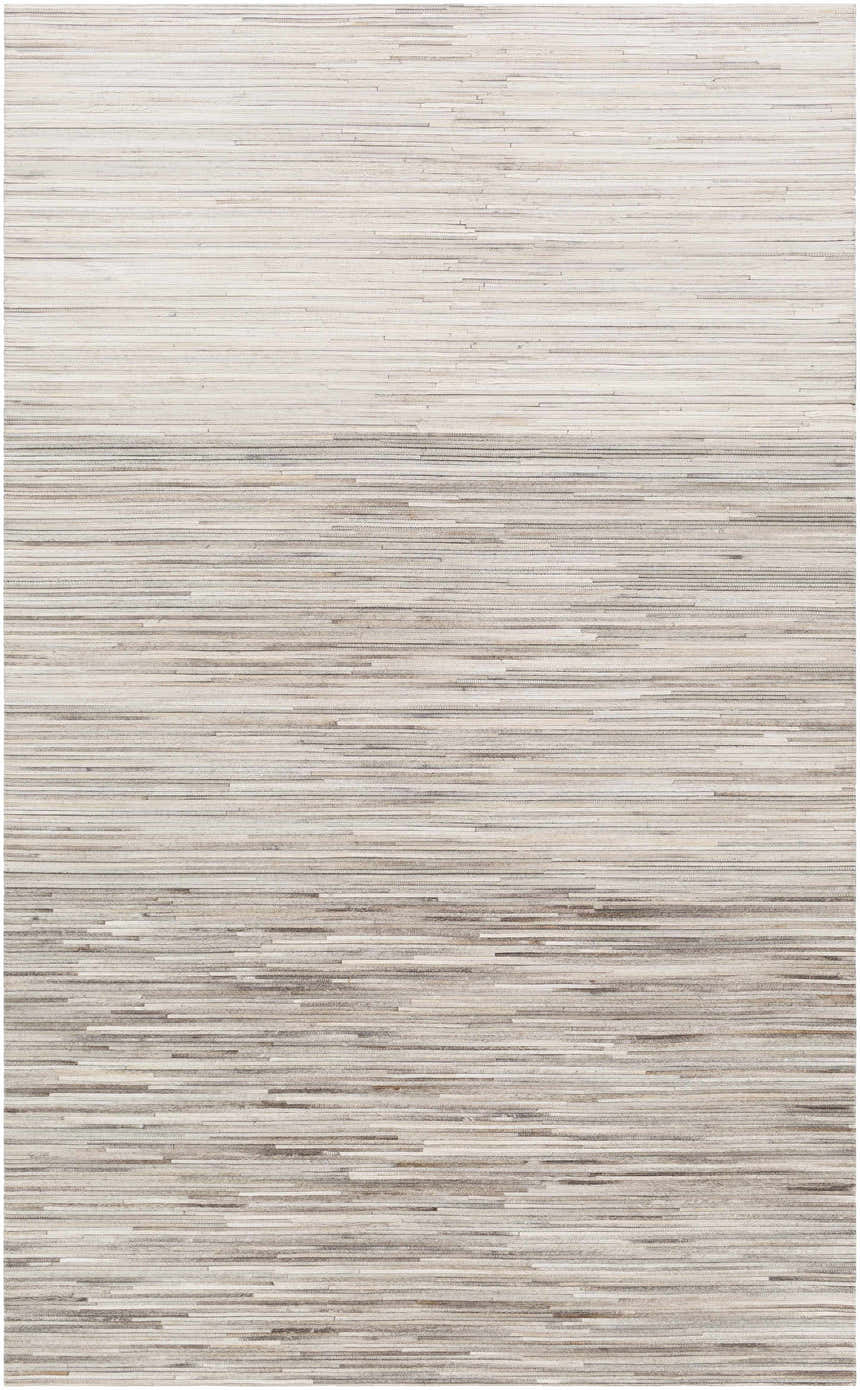 Close-up of the Karabar Premium Area Rug, a hand-crafted, hair-on-hide rug in beige, brown, and silver gray tones. Design-Rectangle-58