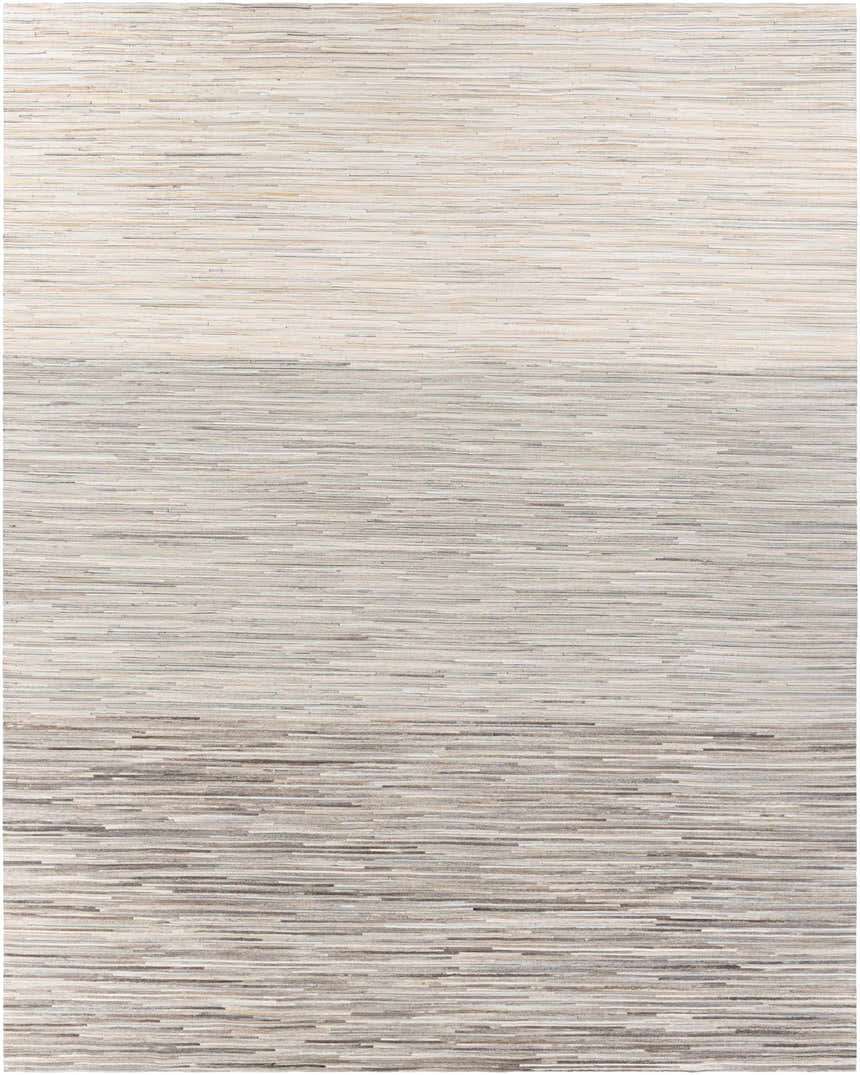 Close-up of the Karabar Premium Area Rug. Hand-crafted hair on hide rug in beige, brown, and gray horizontal stripes. Design-Rectangle-810