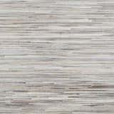 Close-up of Karabar Premium Area Rug showing beige, brown, and gray hair on hide strips. Hand-crafted texture. Swatch