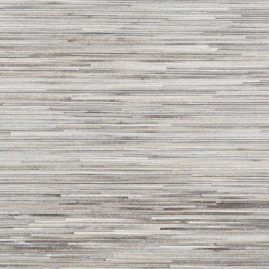 Close-up of Karabar Premium Area Rug showing beige, brown, and gray hair on hide strips. Hand-crafted texture. Swatch