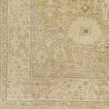 Close-up of the Karalee Handmade Wool Area Rug showing its beige, olive, and dusty pink traditional design. Swatch