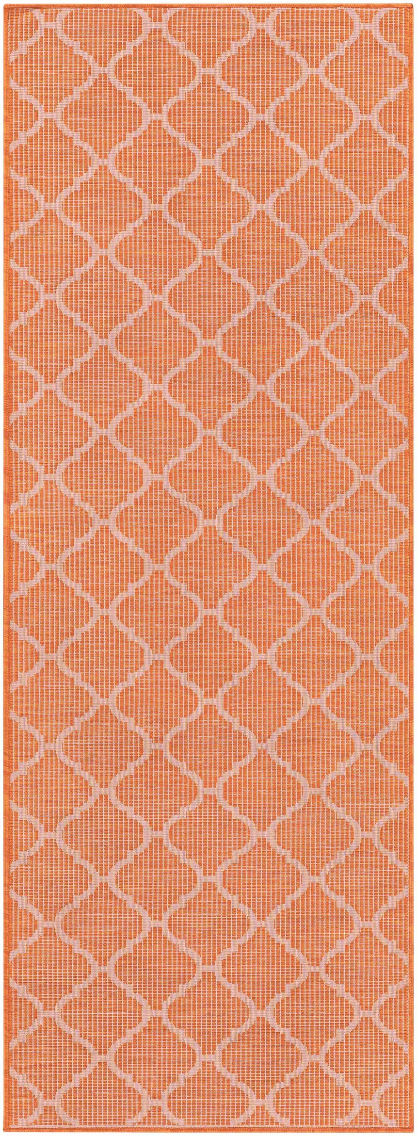 Close-up of Unique Outdoor Trellis Area Rug, rust red. Burnt orange rug with a geometric trellis pattern. Design-Runner-2773
