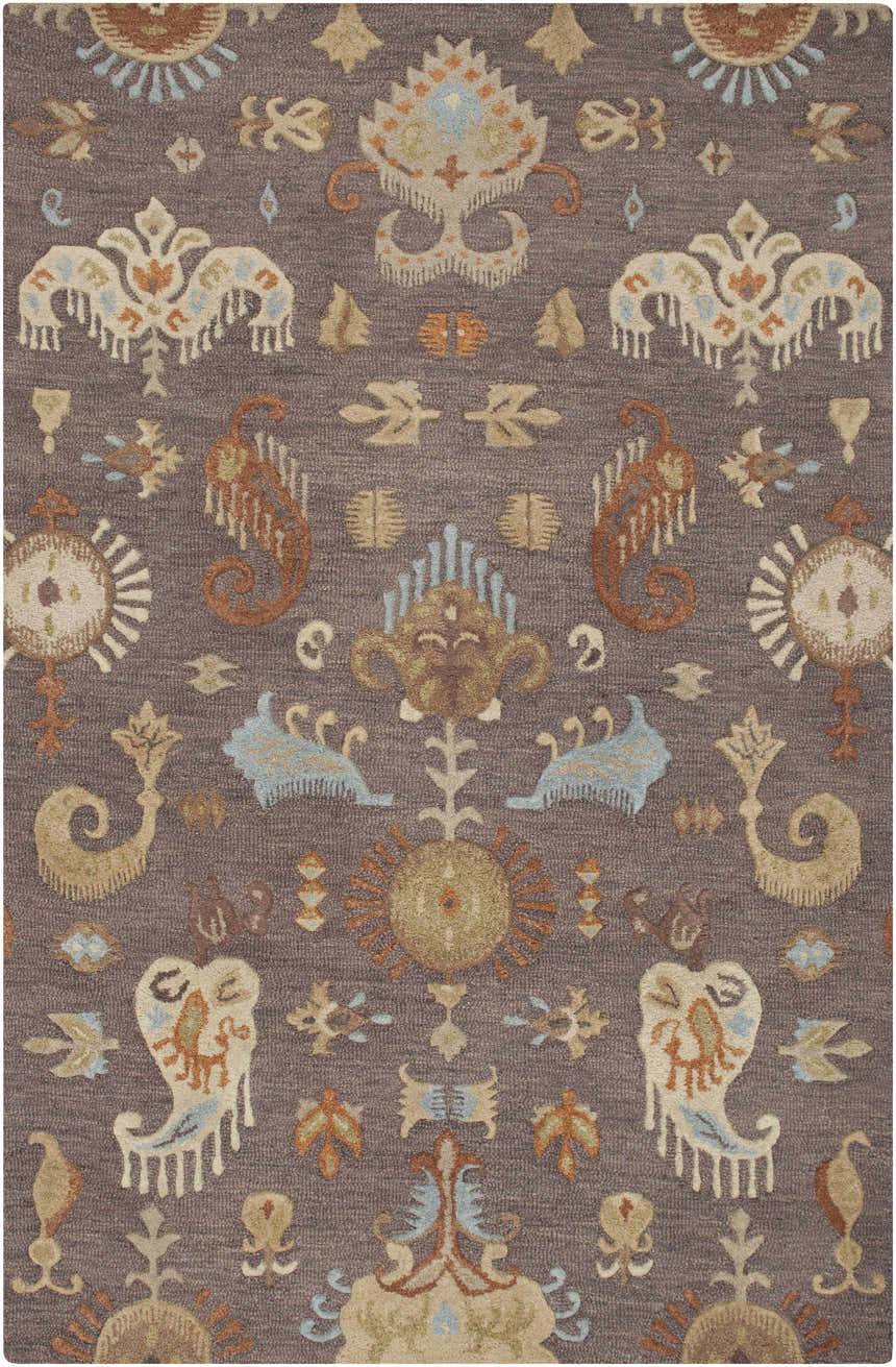 Close-up of the Kelty Area Rug. Hand-hooked wool rug in beige, burnt orange, gray, and blue with a traditional pattern. Design-Rectangle-58