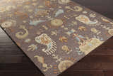 Close-up of the Kelty Area Rug showing a hand-hooked design with beige, orange, and blue accents on a gray wool rug. Corner