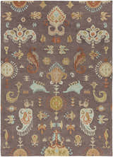 Close-up of the Kelty Area Rug: a hand-hooked wool rug with a traditional pattern in beige, orange, gray, and blue. Design-Rectangle-811