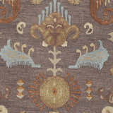 Detailed close-up of the hand-hooked Kelty Area Rug. Features beige, burnt orange, blue, and gray traditional floral patterns. Swatch