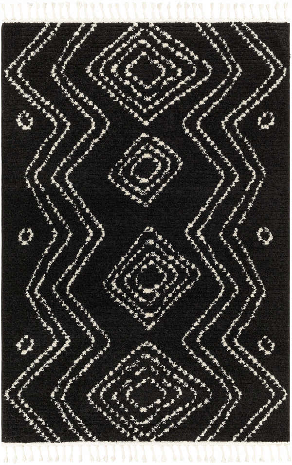 Close-up of the Kemer Area Rug: a black rug with a white geometric diamond pattern and fringe. Design-Rectangle-537