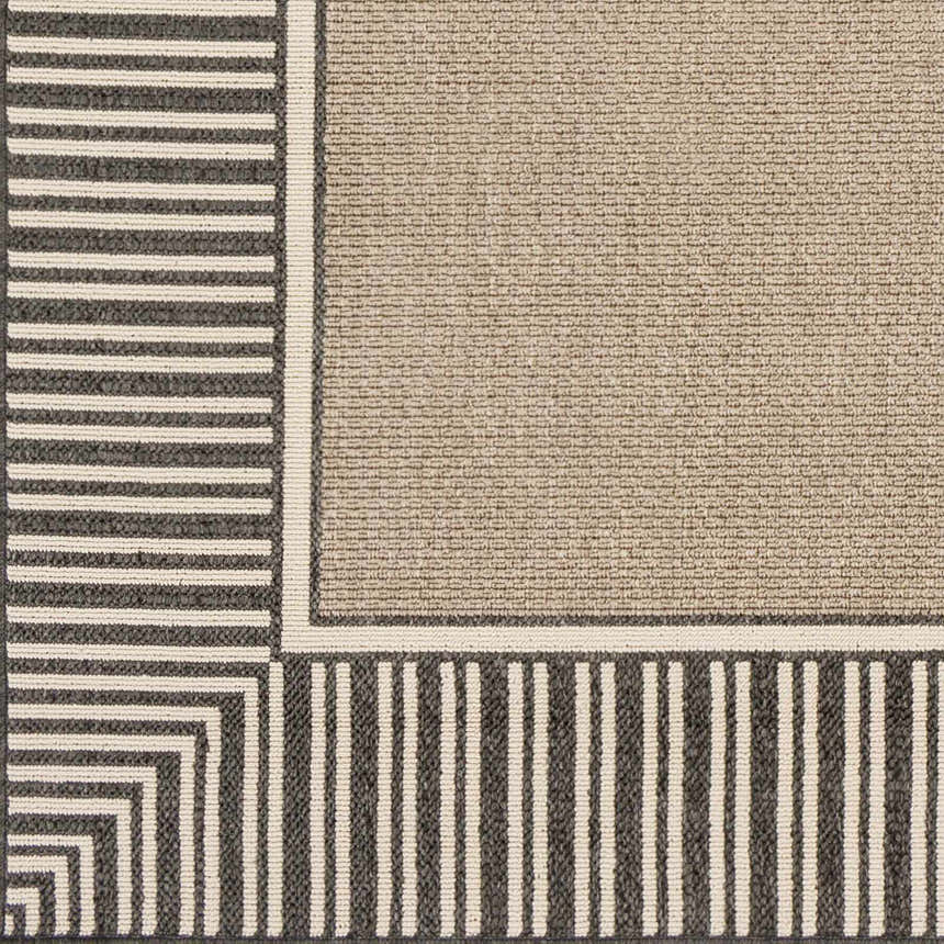 Close-up of the Kidron Area Rug. Beige rug with black and white striped border. Contemporary, farmhouse style. Swatch