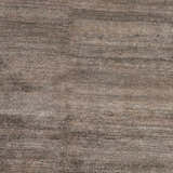 Close-up of the Kingwood Area Rug showing a striated texture in dark and light brown viscose. Swatch