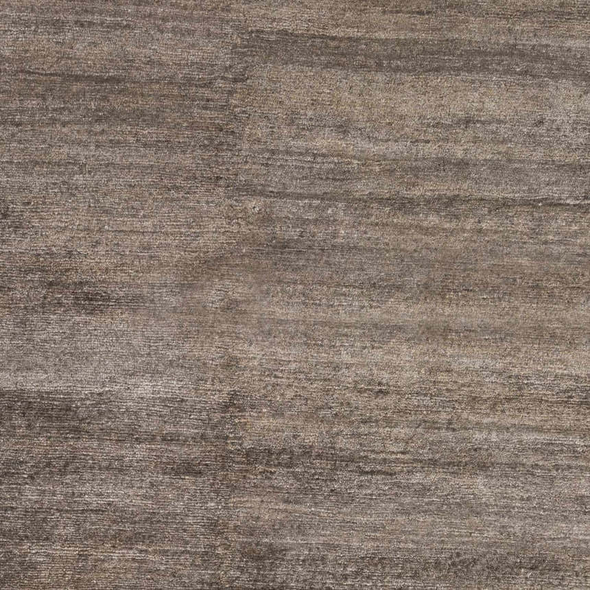 Close-up of the Kingwood Area Rug showing a striated texture in dark and light brown viscose. Swatch