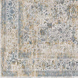 Close up of the Kintbury Area Rug showing its detailed blue, mustard, and off white bohemian pattern. Swatch