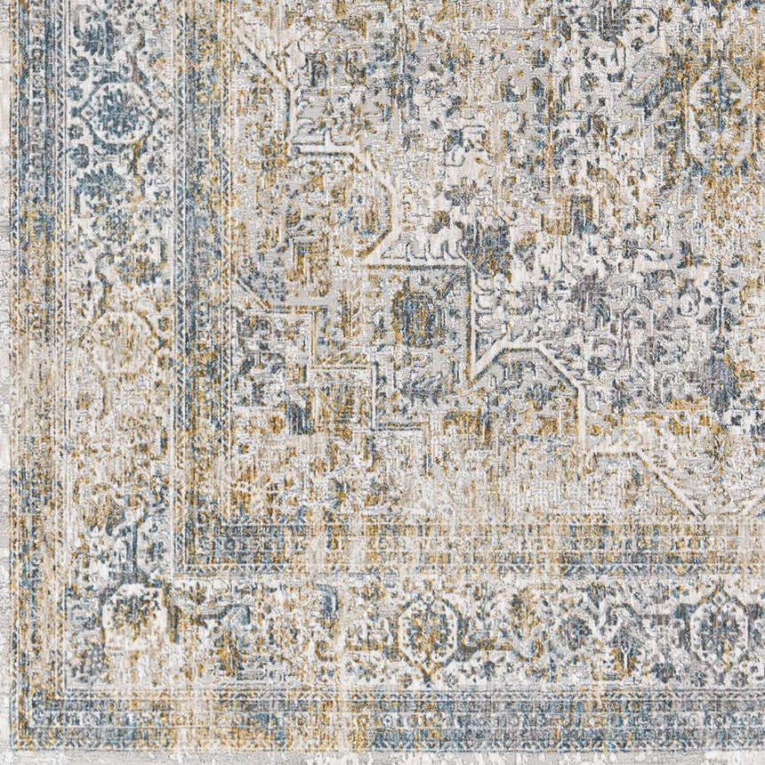 Close up of the Kintbury Area Rug showing its detailed blue, mustard, and off white bohemian pattern. Swatch