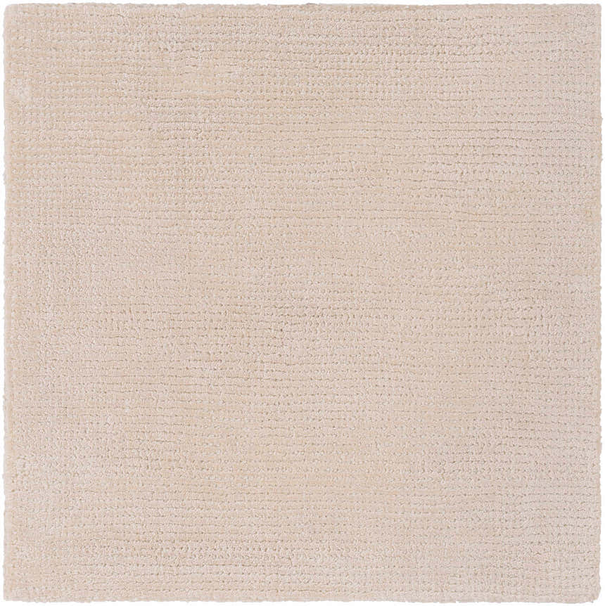 Close-up of the hand-loomed Klickitat Area Rug. Peach and white Tencel fibers create a soft, textured contemporary design. Swatch