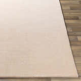 Close-up of the hand-loomed Klickitat Area Rug in peach and white, showing texture and construction. Front