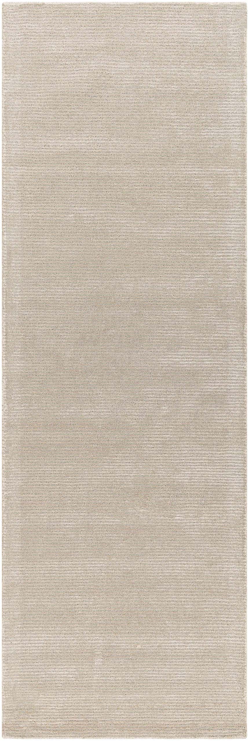 Close-up of the light gray Keller Area Rug, a hand-tufted wool and viscose rug with a subtle striped texture. Design-Runner-268