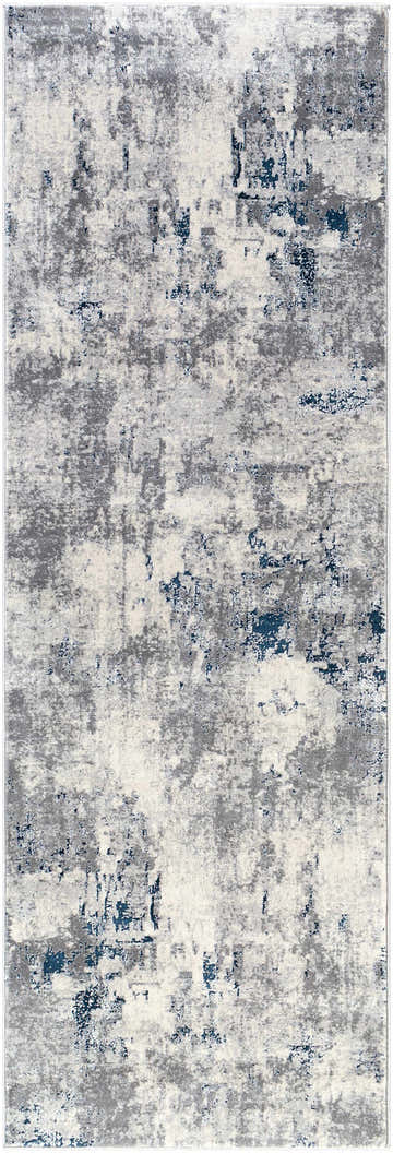 Close-up of the Killara Faux Silk Rug; a contemporary rug in blue, charcoal, light gray, and off-white. Abstract pattern. Design-Runner