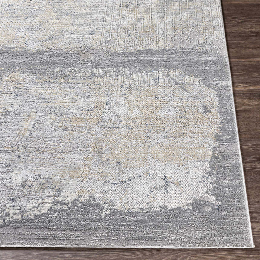 Close-up of the Kallangur Luxe Area Rug showing beige, gray, and charcoal abstract pattern and textured machine woven construction. Front