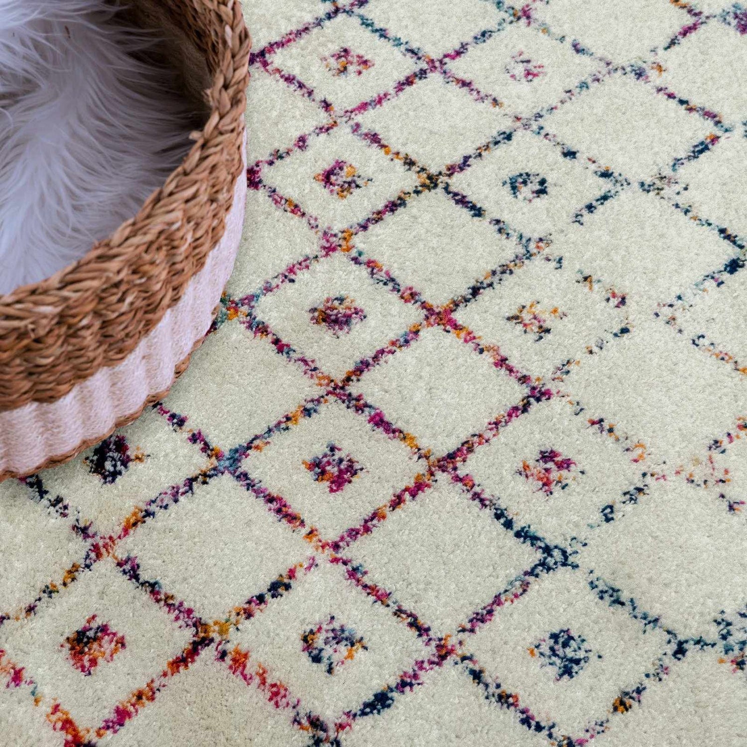 Close-up of the Marash KMRSH-4600 area rug featuring a colorful diamond pattern on an off-white background. Styleshot