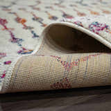 Close-up of the Marash KMRSH-4600 area rug showing its off-white base with colorful bohemian pattern and the rug's backing. Fold