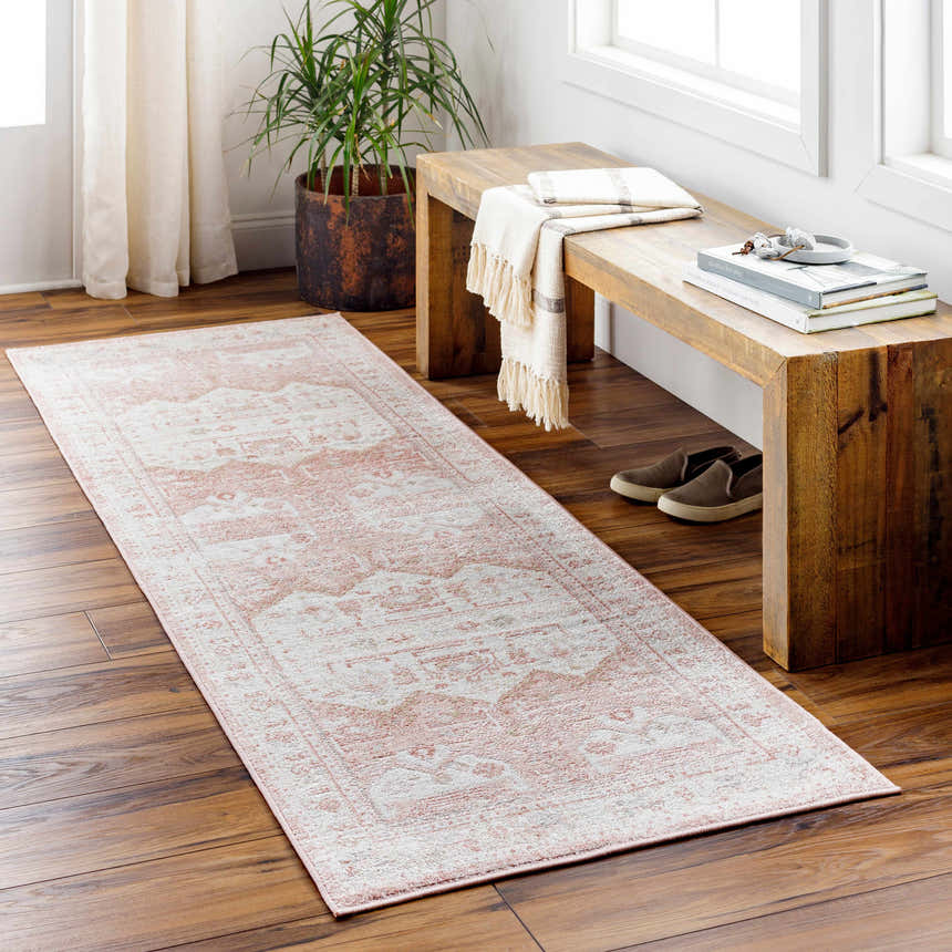 Entryway with a light pink Kendal Area Rug runner, wood bench, and potted plant. Roomscene-Runner