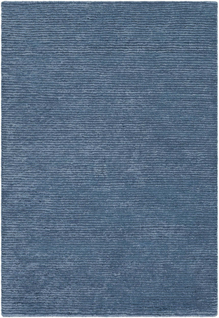 Close-up of the blue Kendall Carpet. Hand-knotted rug with a subtle horizontal stripe texture. Farmhouse style. Design-Rectangle-23