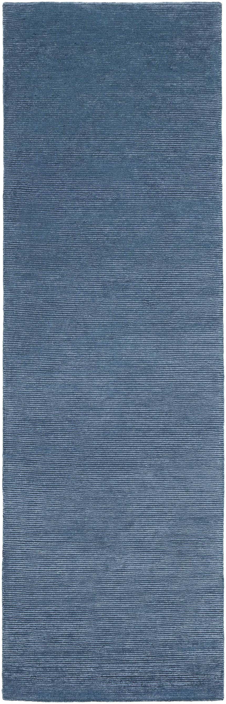 Close-up of the blue Kendall Carpet. Hand-knotted rug in farmhouse, traditional, and transitional style. Design-Runner-268