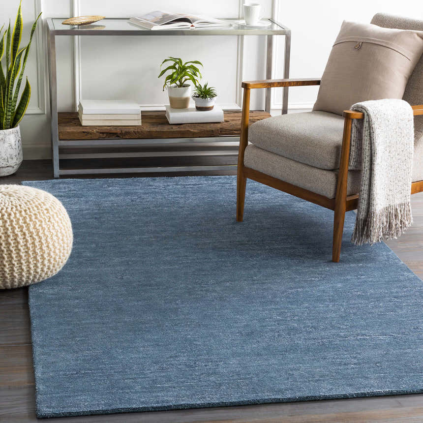 Transitional living room with a blue Kendall Carpet, gray chair, and neutral decor. Roomscene-Rectangle