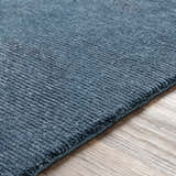 Close-up of the blue Kendall Carpet showing its hand-knotted texture and wool-viscose blend. Texture