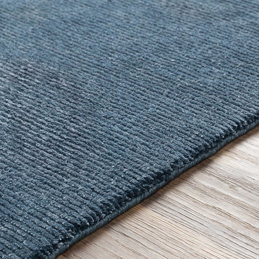Close-up of the blue Kendall Carpet showing its hand-knotted texture and wool-viscose blend. Texture