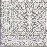 Close-up of the Kinglake Area Rug, featuring a detailed gray and white bohemian pattern. Swatch