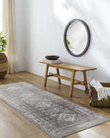 Hallway scene with Kingscourt Washable Area Rug runner in cream, gray, and brown. Bench, mirror, and plant complete the decor. Roomscene-Runner