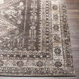 Close-up of the Kingscourt Washable Area Rug. Traditional oriental rug design in cream, taupe, and dark brown colors. Front
