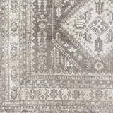 Close-up of the Kingscourt Washable Area Rug. Features a traditional oriental pattern in cream, gray, and taupe. Swatch