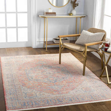 Entryway with Tusa Light Pink Area Rug, gold console table, and woven chair. Neutral, light-filled, traditional style. Roomscene-Rectangle