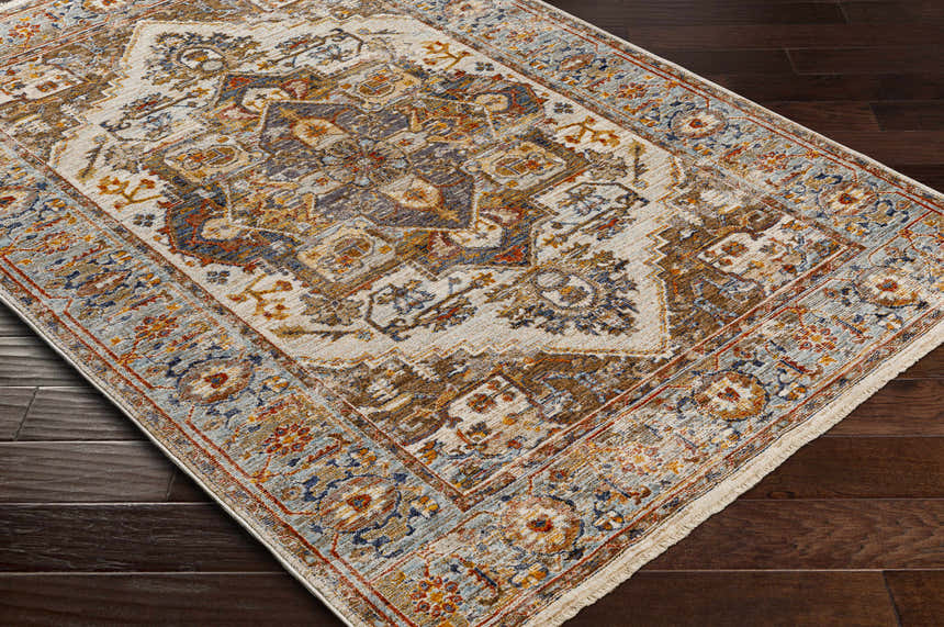 Close-up of the Kokstad Area Rug. Traditional oriental design in arctic stone, beige, brown, mocha, and taupe. Corner