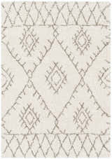 Close up of the Kunia Area Rug featuring a shag texture and a geometric diamond pattern in ivory and charcoal. Design-Rectangle-5373