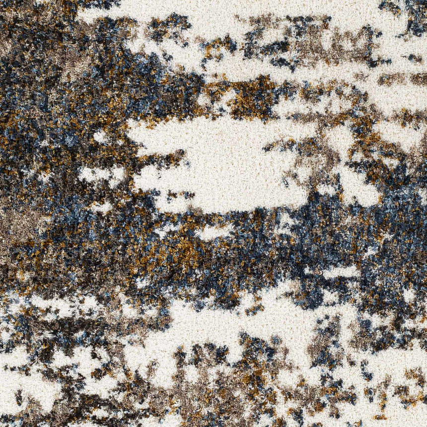Close-up of Lafontaine Boutique Area Rug, cream base with abstract dark blue, brown, and gray pattern. Shag texture. Swatch